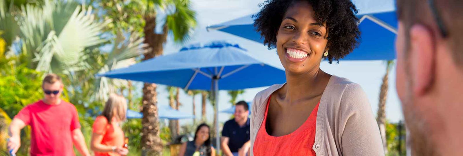 Woman on patio at social event in Waterset, new homes in Apollo Beach.