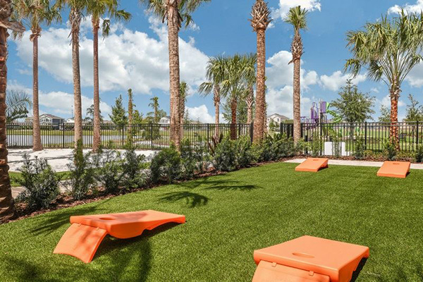 Play area, bean bag toss game at the Waterset Club.