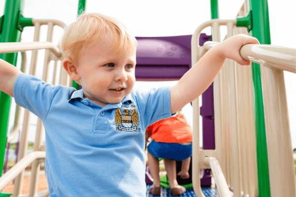 Toddler playing at the Lakeside playground in Waterset.
