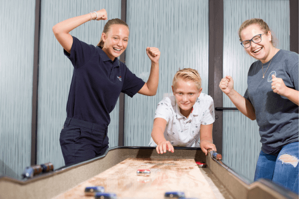 Kids playing in the Game Room at The Waterset Club amenity.
