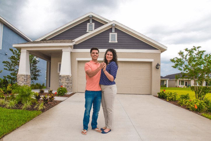 First-time home buyers at their new construction home in Apollo Beach Waterset by Newland