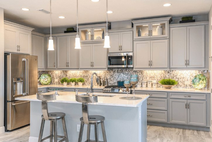 The backsplash in the Sandpiper by Homes by WestBay is a captivating focal point in this kitchen.