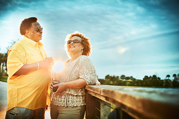 Couple along the lakeside trail at sunset in Waterset.