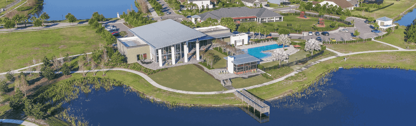 Aerial view of The Landing, pool, and lake in Waterset.