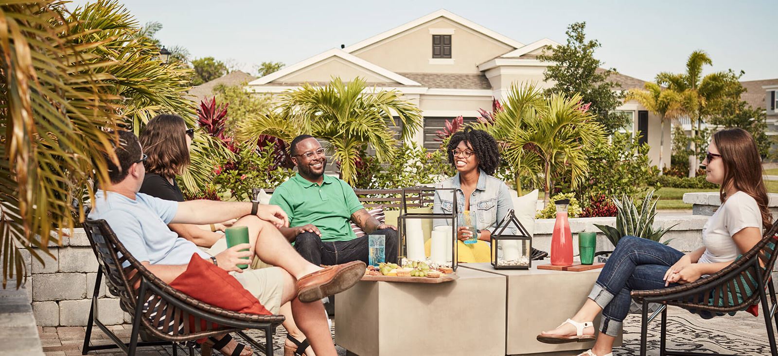 Friends enjoy the backyard of a new home in Waterset