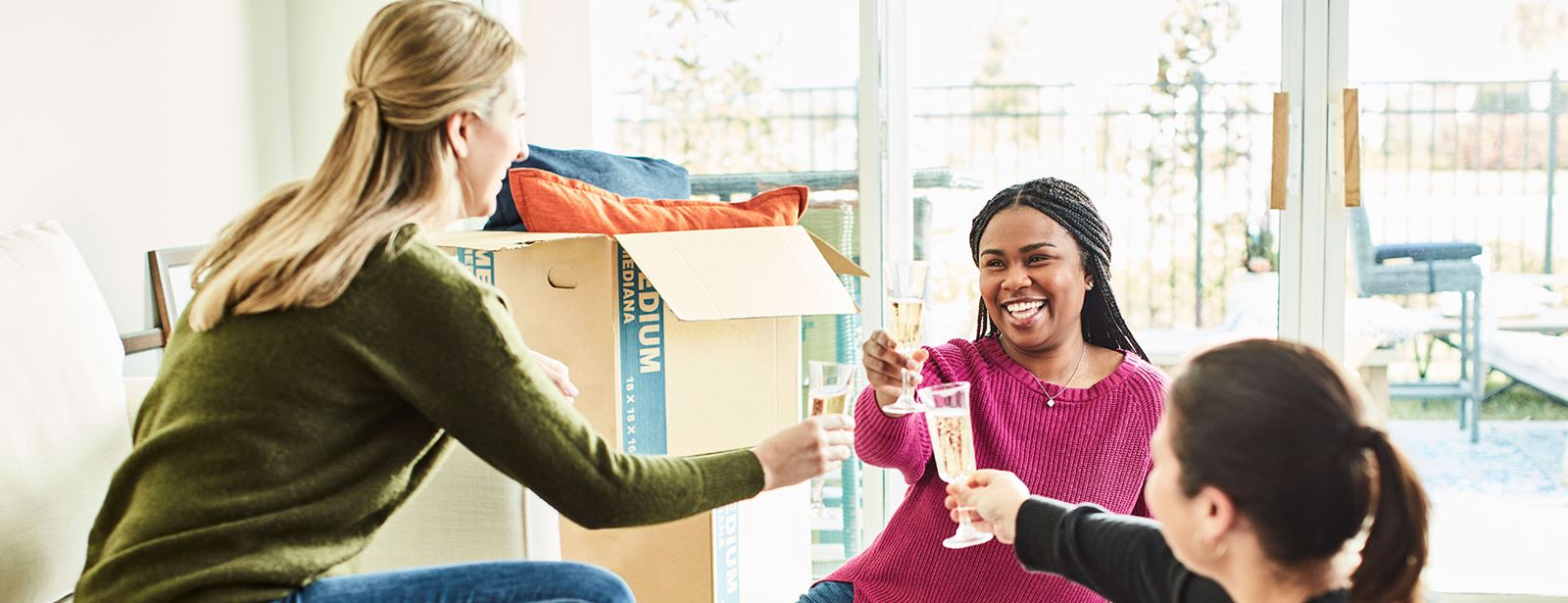 Women toasting new home move